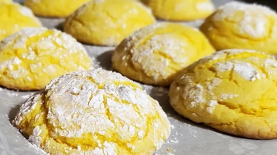 A rack of lemon crackle drop cookies fresh from the oven