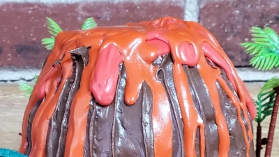 Volcano Birthday Cake; Chocolate cake with vanilla buttercream and chocolate decorations - 8” equivalent