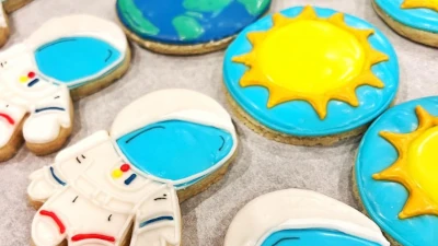 Space-themed birthday cookies -astronauts, sun, and Earth