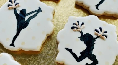 Graduation cookies for a cheerleader - hand-painted with 3D piped pom-poms