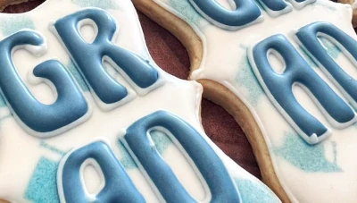 Blue and white graduation cookies