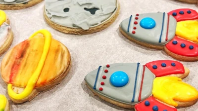 Space-themed birthday cookies - rockets, planets, and moon