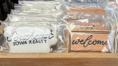 Single packaged cookies, neatly placed on a newer wooden sales rack.